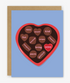 Greeting card with a heart-shaped chocolate design and text on a blue background