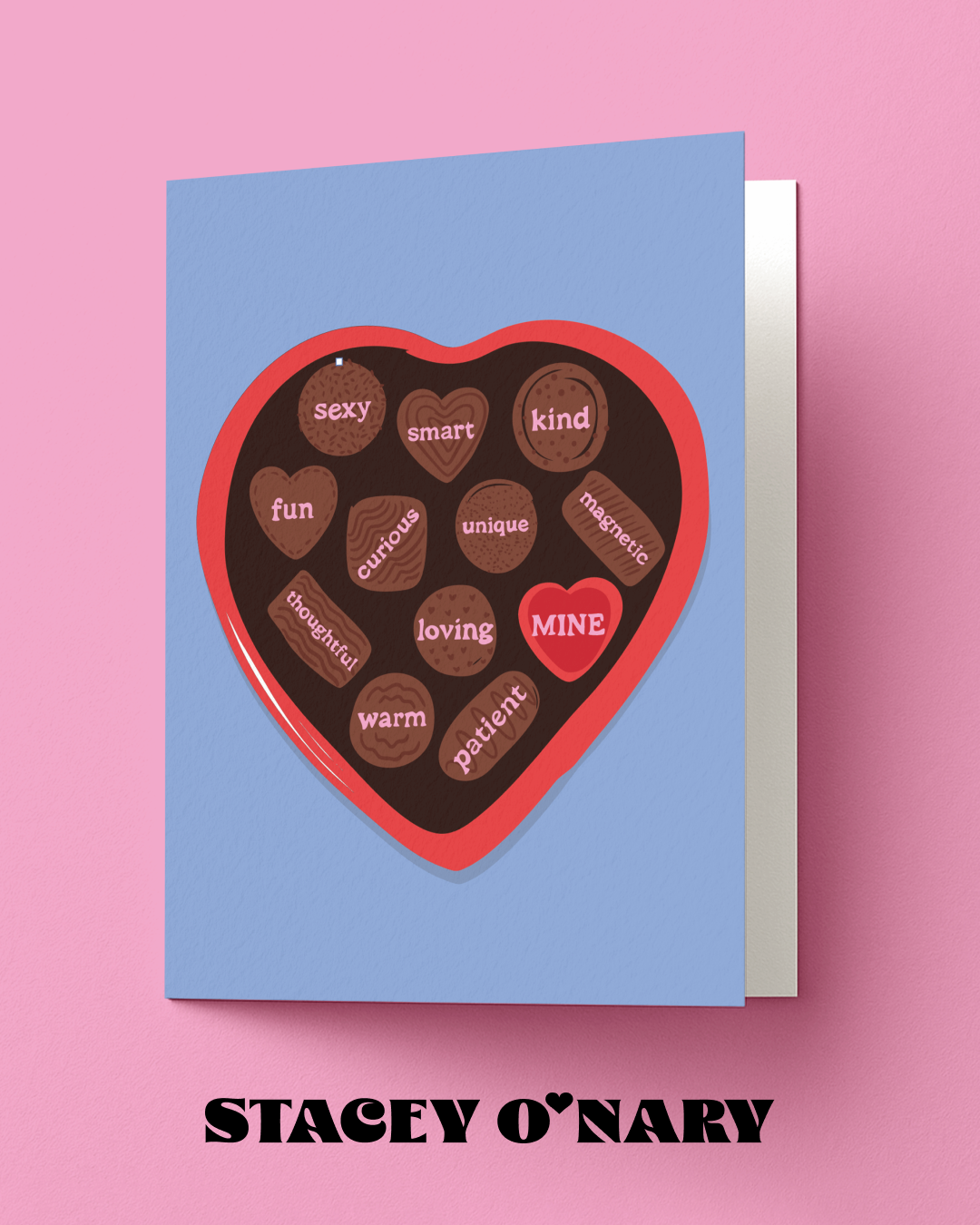 Card with heart-shaped chocolate candy design and text on a pink background, featuring the brand 'Stacey O'Nary'.