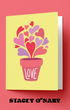 Greeting card with heart design and 'LOVE' text on a pink background, featuring the brand 'Stacey O'Nary'.