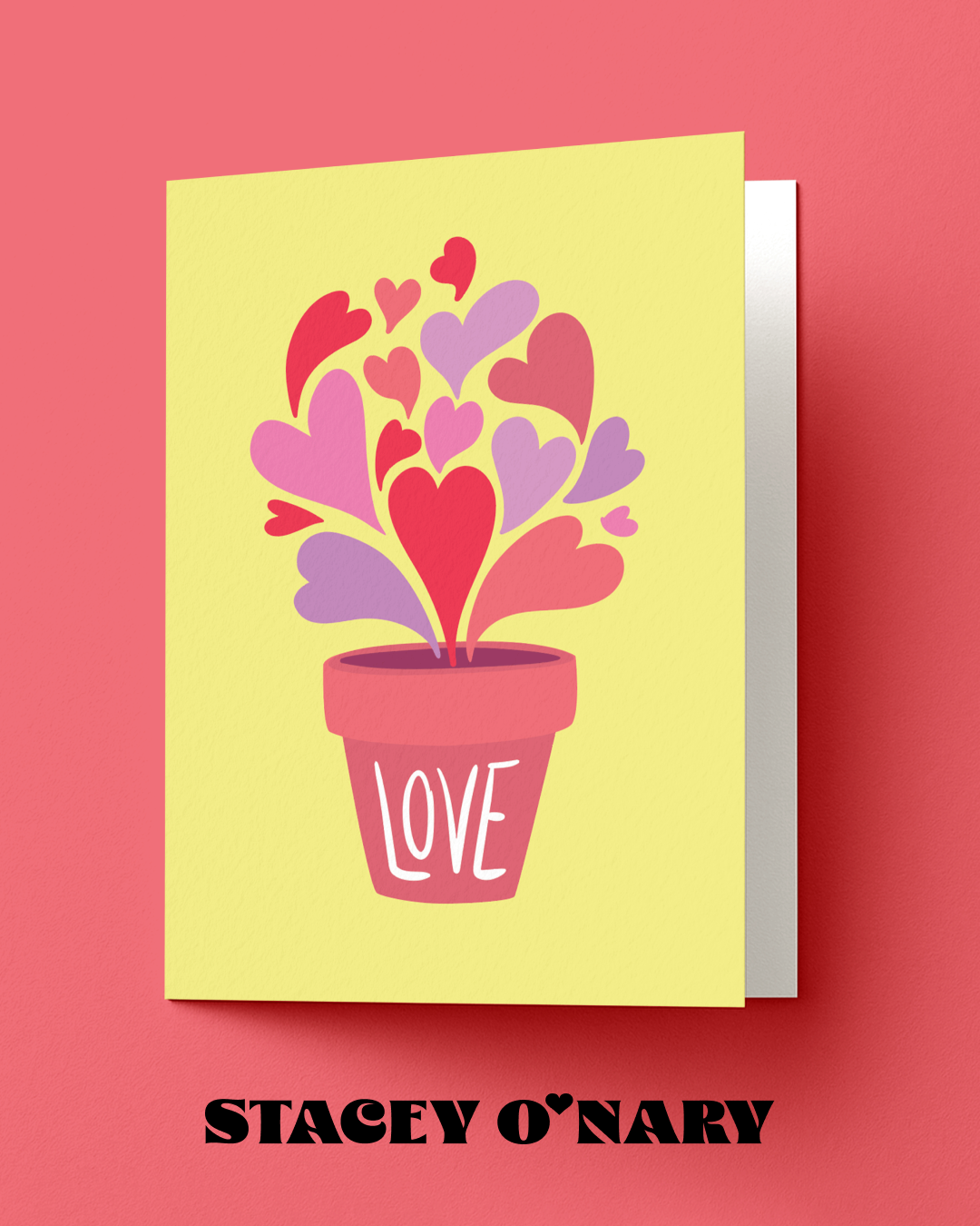 Greeting card with heart design and 'LOVE' text on a pink background, featuring the brand 'Stacey O'Nary'.