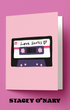Card with a cassette tape design labeled 'Love Songs' on a pink background, featuring the brand 'Stacey O'Nary'.