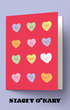 Card with colorful heart-shaped words on a red background, featuring the brand 'Stacey O'Nary'.
